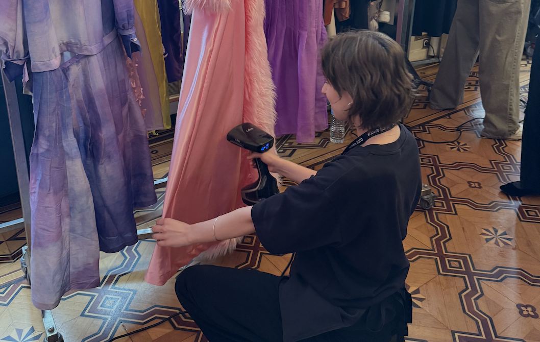 Collarts student steaming colourful garments while studying fashion in Paris 