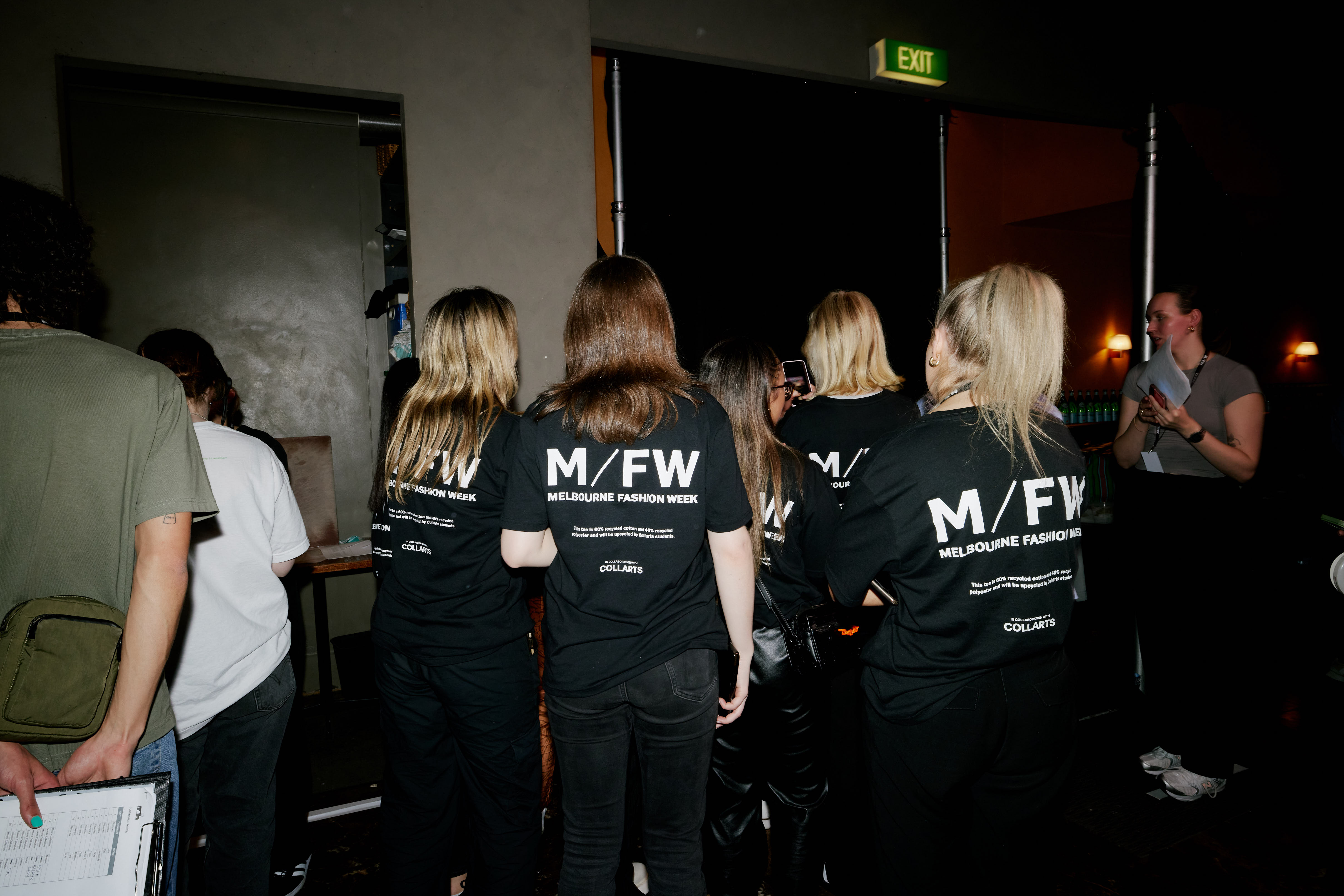 Group of Collarts students interning at Melbourne Fashion Week wearing branded t-shirts
