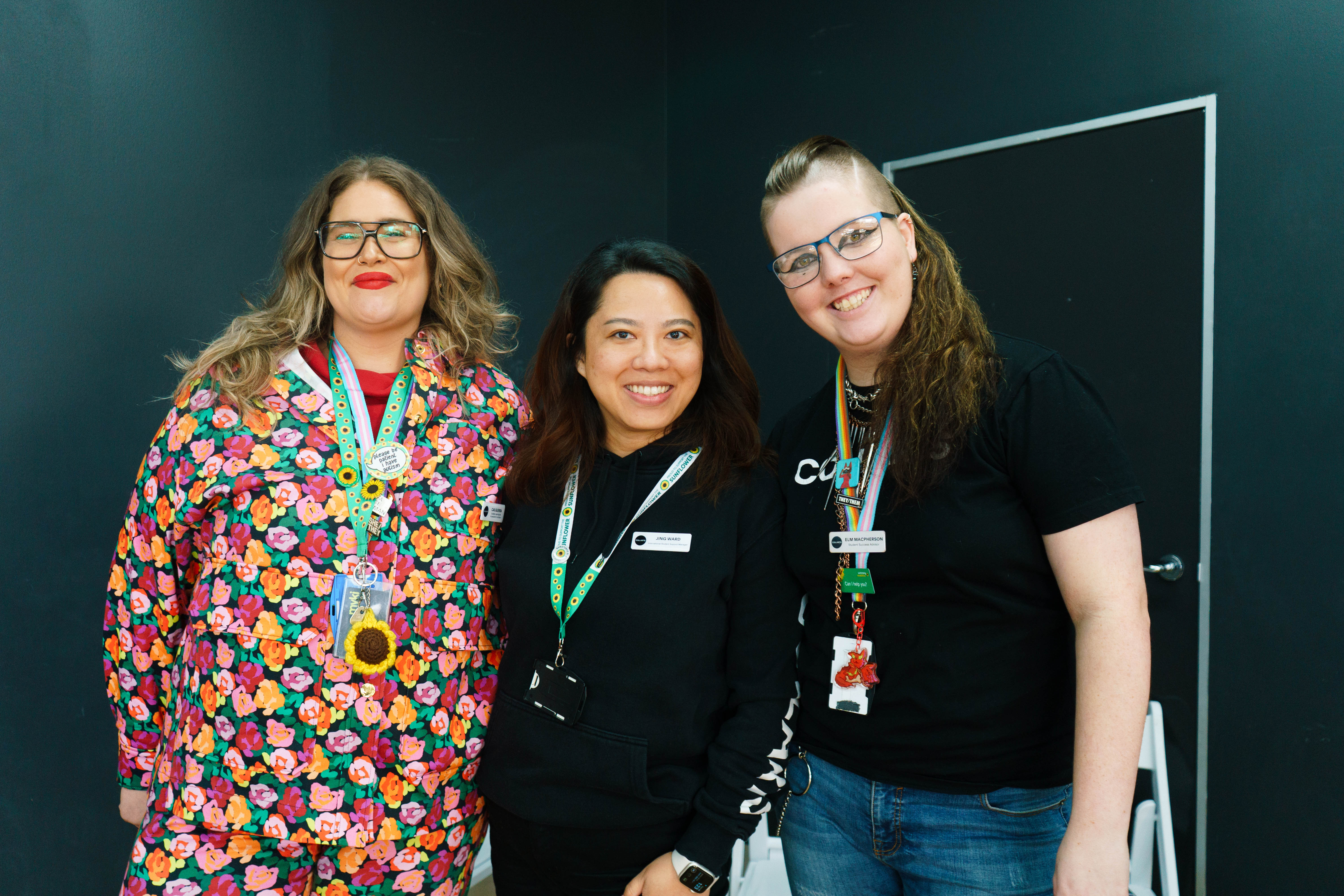 Three Collarts student support team members standing together and smiling 